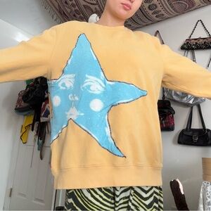 Yellow Sweatshirt with Blue Star Design